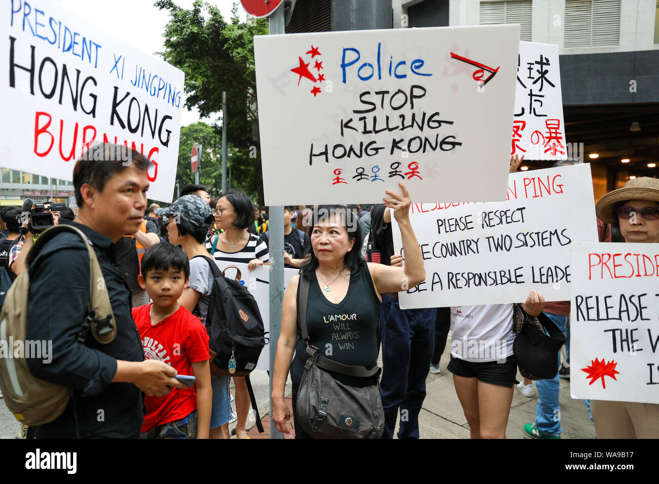 Hong Kong. 18th Aug, 2000. Protesters including former Legislative Council member Leung Kwok-hung 'Longhair' began an unauthorized march during torrential rain outside Victoria Park where a rally organised by the Civil Human Rights Front was being held which organizers claim more than 1.7 million people attended. 18th August 2019. Credit: David Coulson/Alamy Live News Stock Photo