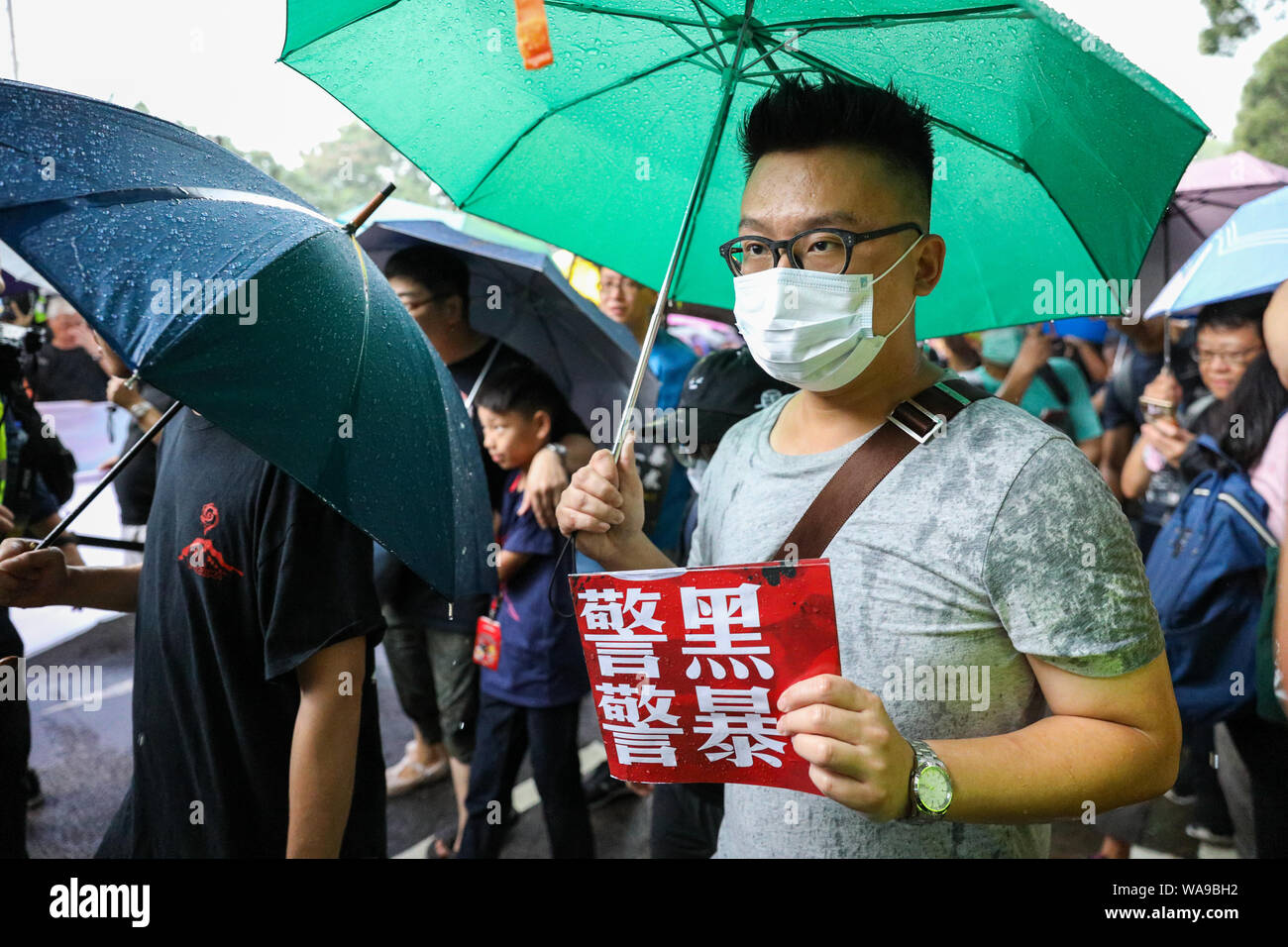 Hong Kong. 18th Aug, 2000. Protesters' began an unauthorized march during torrential rain outside Victoria Park where a rally organised by the Civil Human Rights Front was being held which organizers claim more than 1.7 million people attended. 18th August 2019 Credit: David Coulson/Alamy Live News Stock Photo