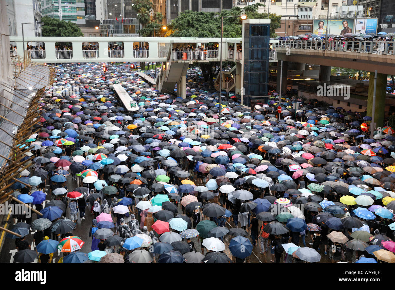 Hong Kong. 18th Aug, 2000. Huge number of protesters holding umbrellas on an unauthorized march during rain marching through the streets of Causeway Bay which organizers claim more than 1.7 million people attended. 18th August 2019 Credit: David Coulson/Alamy Live News Stock Photo