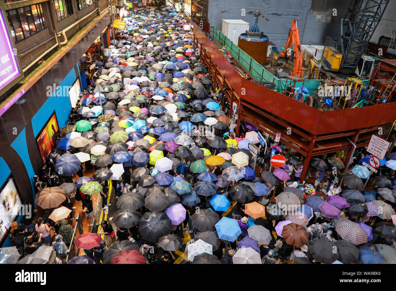 Hong Kong. 18th Aug, 2000. Huge number of protesters holding umbrellas on an unauthorized march during rain marching through the streets of Causeway Bay which organizers claim more than 1.7 million people attended. 18th August 2019 Credit: David Coulson/Alamy Live News Stock Photo