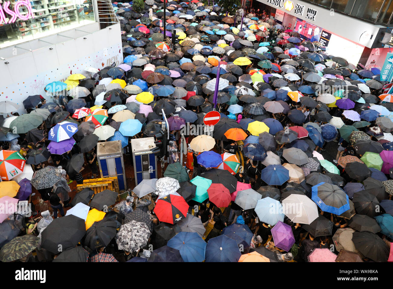 Hong Kong. 18th Aug, 2000. Huge number of protesters holding umbrellas on an unauthorized march during heavy rain marching through the streets of Causeway Bay which organizers claim more than 1.7 million people attended. 18th August 2019 Credit: David Coulson/Alamy Live News Stock Photo