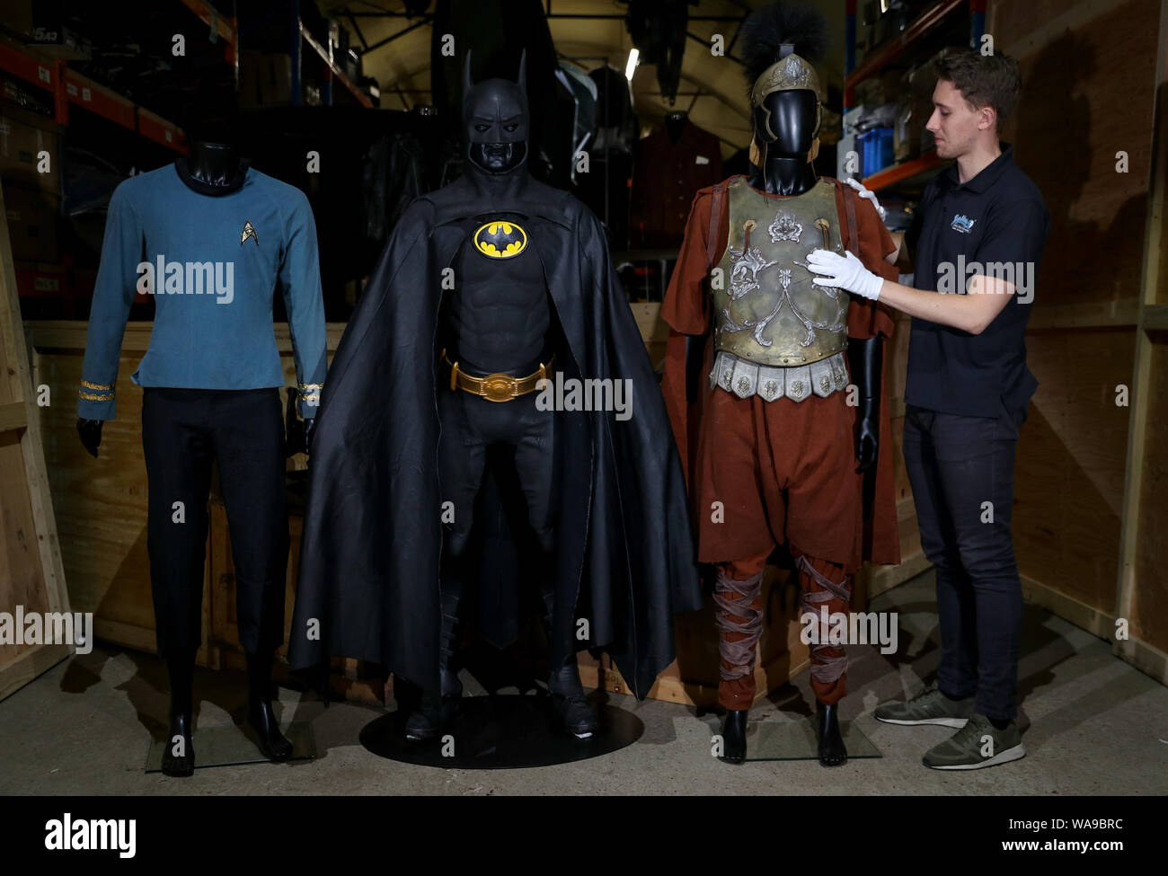 (left to right) Spock's screen matched science officer costume worn by Leonard Nimoy in Star Trek: The Ultimate Computer & The Omega Glory (TV series 1966-1969) (estimate ??50-70,000), Michael Keaton's Batsuit from the 1989 film Batman (estimate ??80-120,000) and Maximus screen matched Roman general armour worn by Russell Crowe in the 2000 film Gladiator (estimate ??30-50,000), during a preview of the forthcoming film and television memorabilia auction at the Prop Store head office near Rickmansworth. Stock Photo