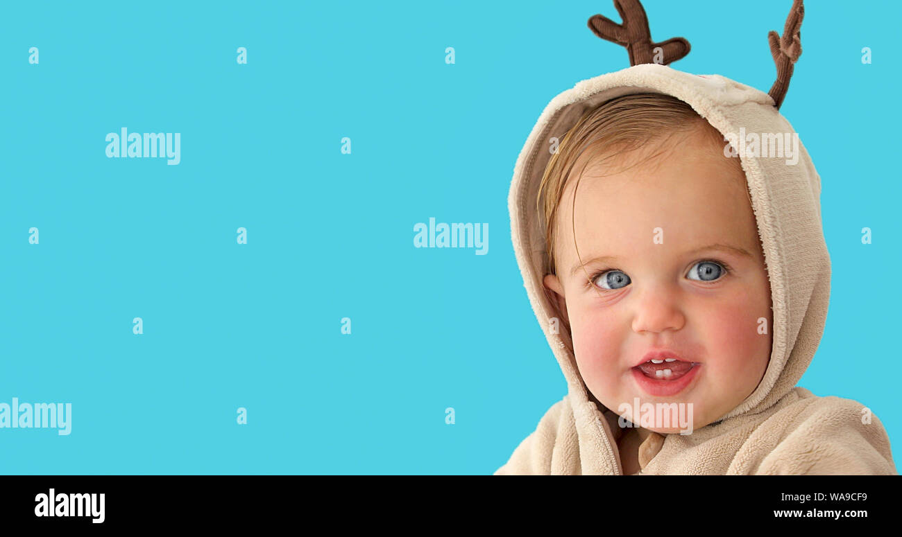 Cute little baby girl in a deer costume Stock Photo