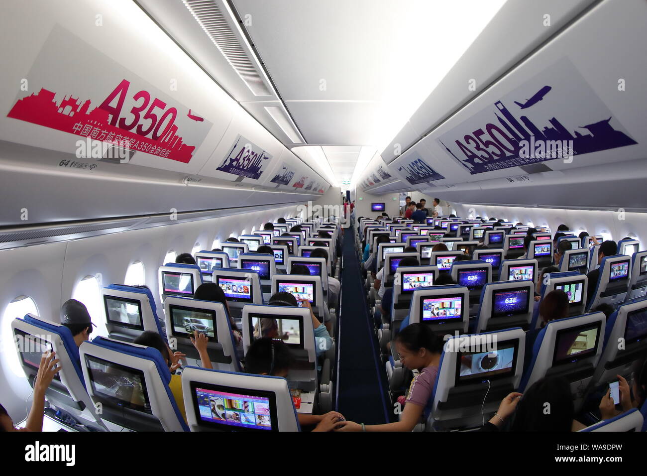 Interior view of the economy class for the first Airbus A350-900 jet plane  featuring new seat products of China Southern Airlines at the Guangzhou Bai  Stock Photo - Alamy