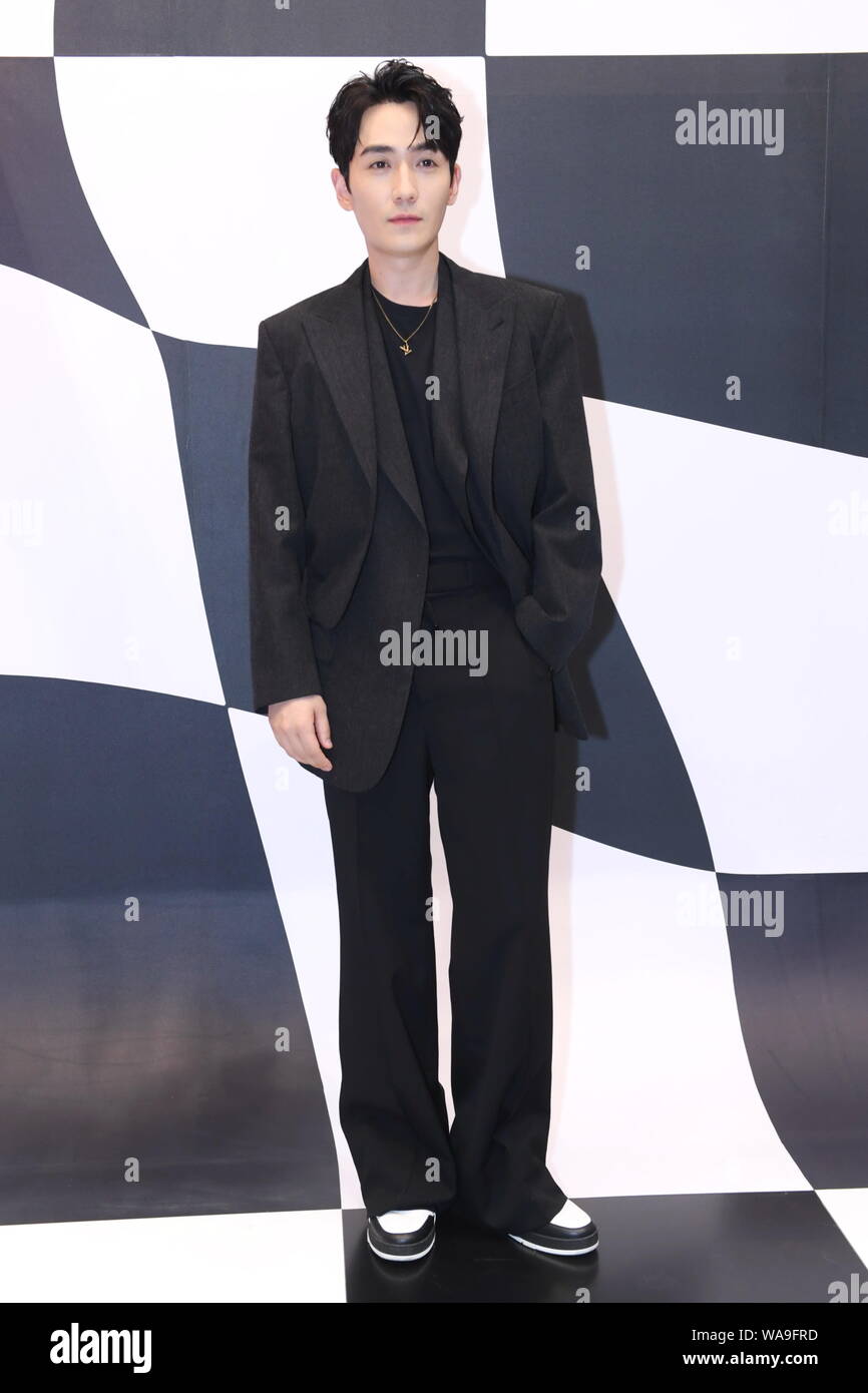 Dylan Wang wearing a Louis Vuitton Black Suit a style that very