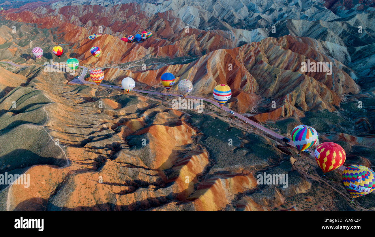 Around 100 hot air balloons are displayed at the Qicai Danxia scenic ...