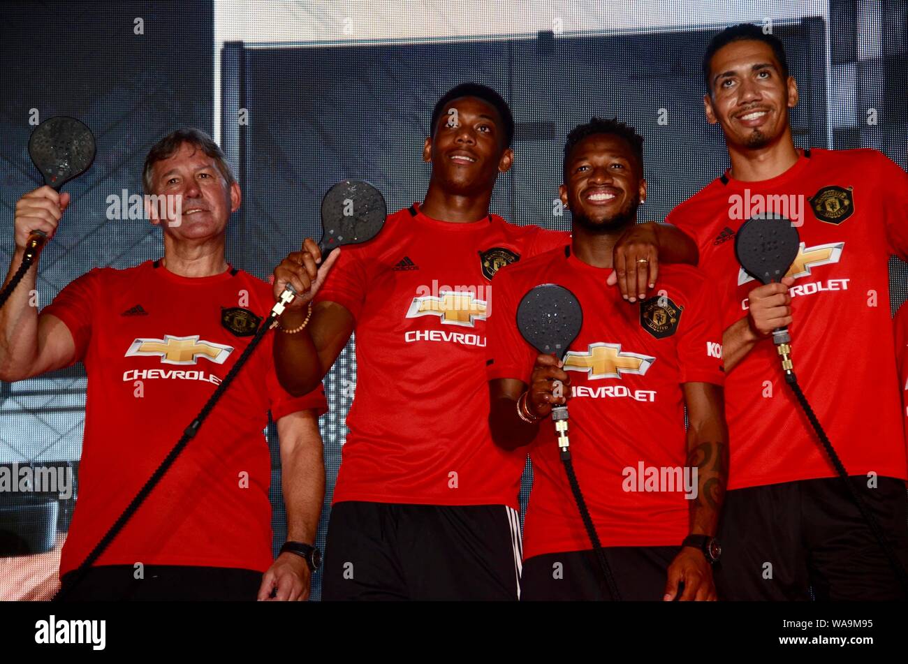 (From left) English football manager Bryan Robson, French football player Anthony Martial, Brazilian football player Fred, and Chris Smalling of Manch Stock Photo