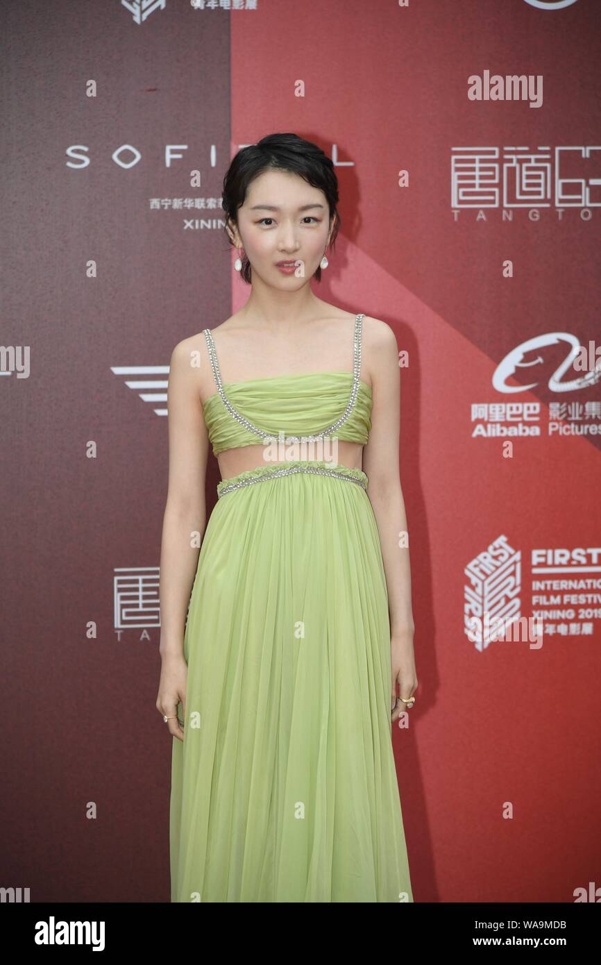 Chinese actress Zhou Dongyu poses as she arrives on the red carpet for the  FIRST International Film Festival in Xining city, northwest China's Qinghai  Stock Photo - Alamy
