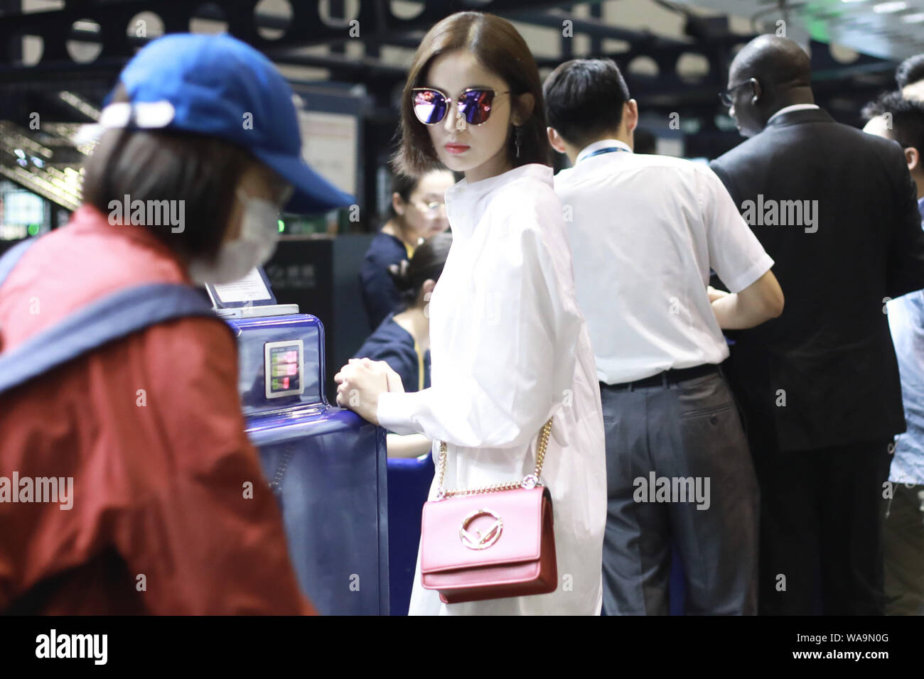 Chinese Uigur actress Gulnezer Bextiyar, also known as Gulnazar or Guli Nazha (Gulinazha), arrives at the Beijing Capital International Airport before Stock Photo