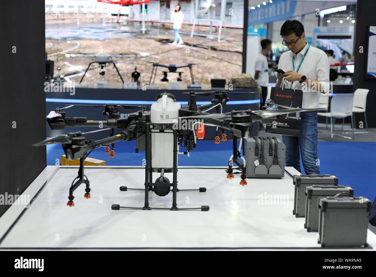 FILE--Customers shop at a store of DJI Technology Co. in Shenzhen city,  south China's Guangdong province, 21 June 2019. The US government has  grante Stock Photo - Alamy