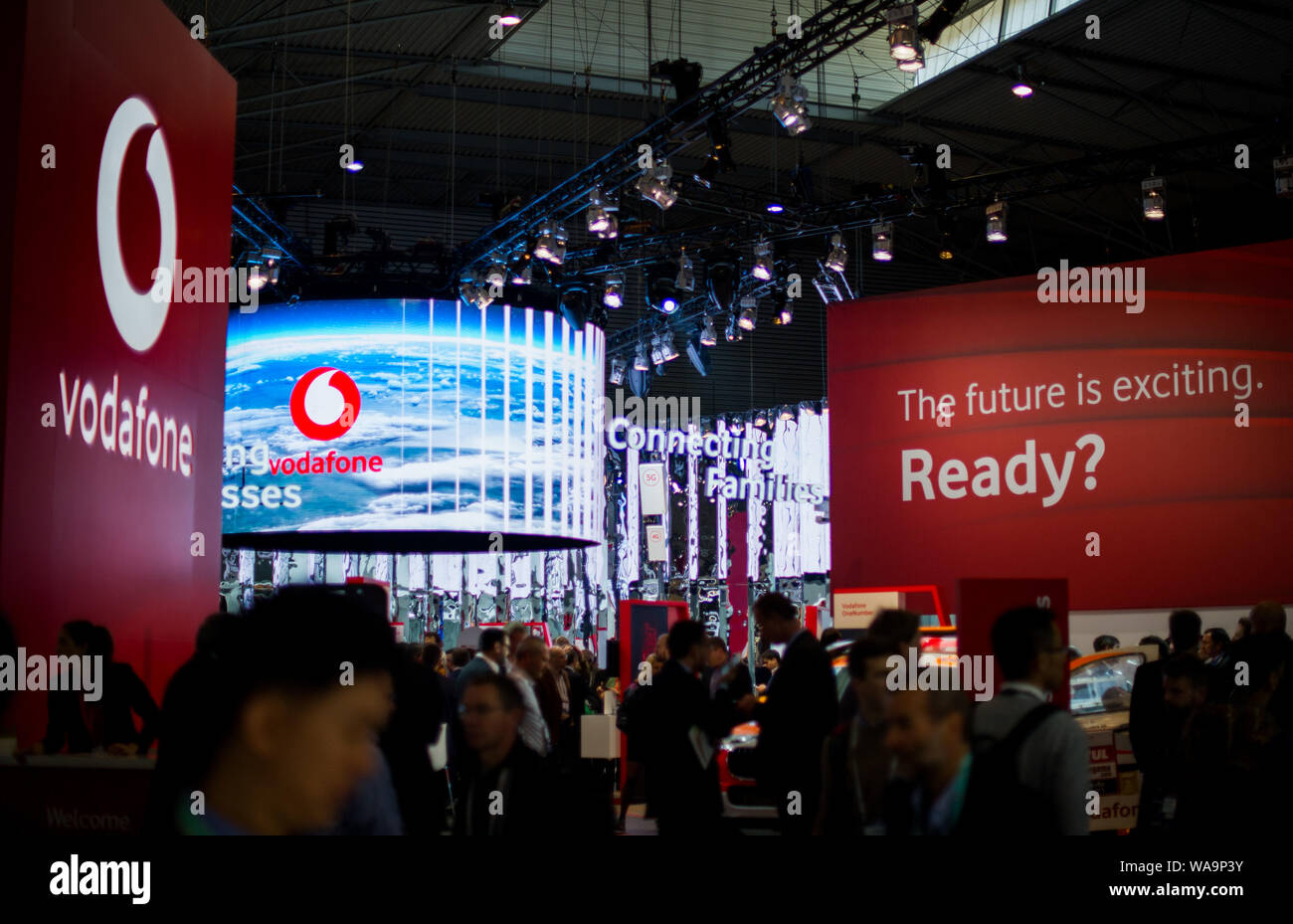 --FILE--People visit the stand of United Kingdom mobile operator Vodafone during the Mobile World Congress 2019 in Barcelona, Spain, 26 February 2019. Stock Photo