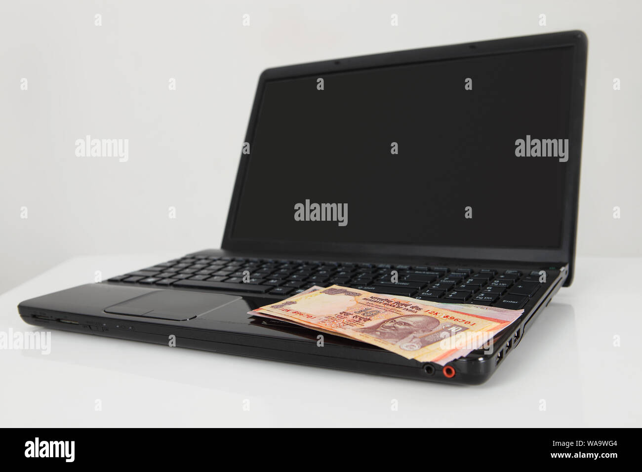 Indian banknotes on laptop hi-res stock photography and images - Alamy