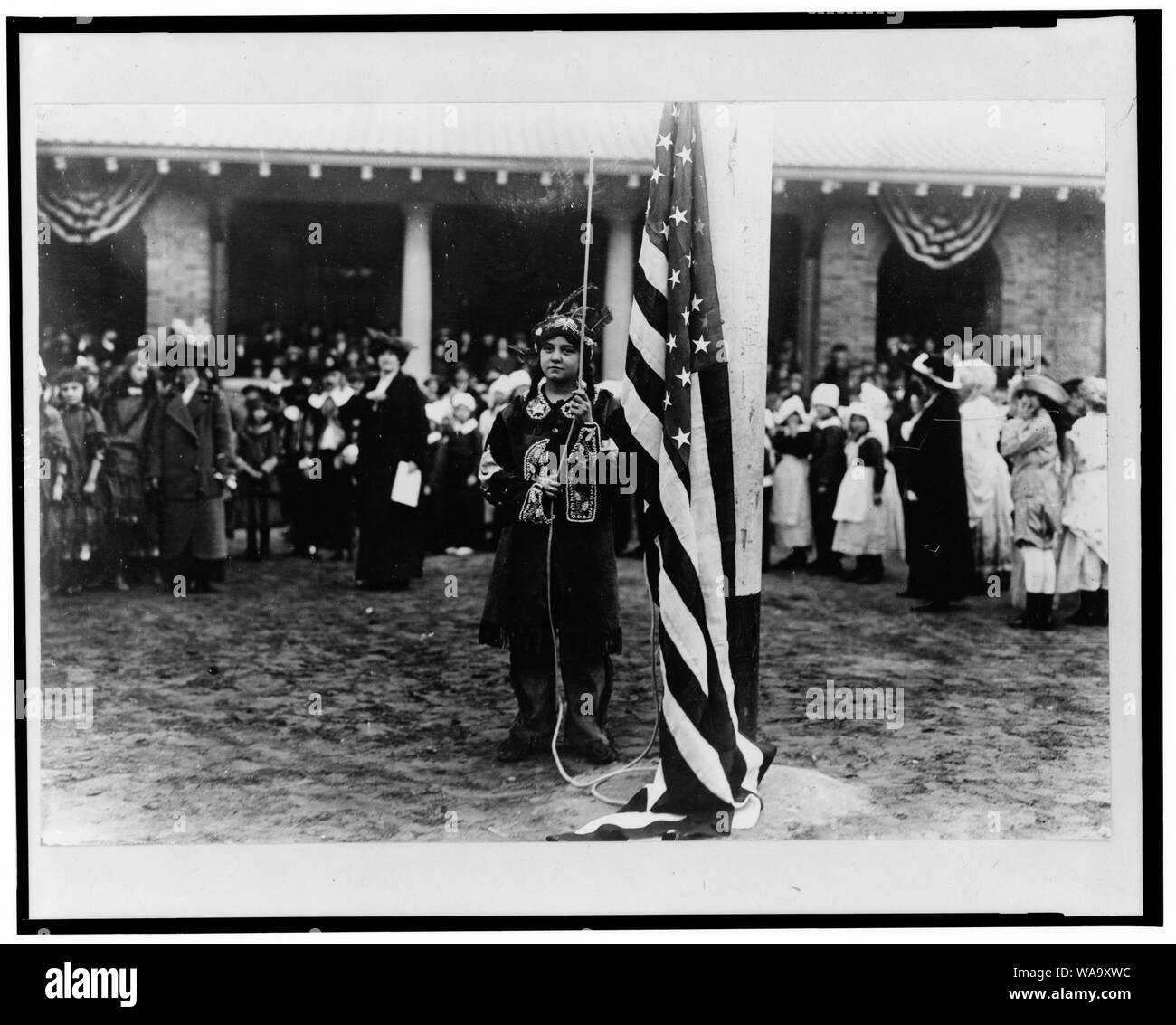 Children raising US flag in NYC park Stock Photo