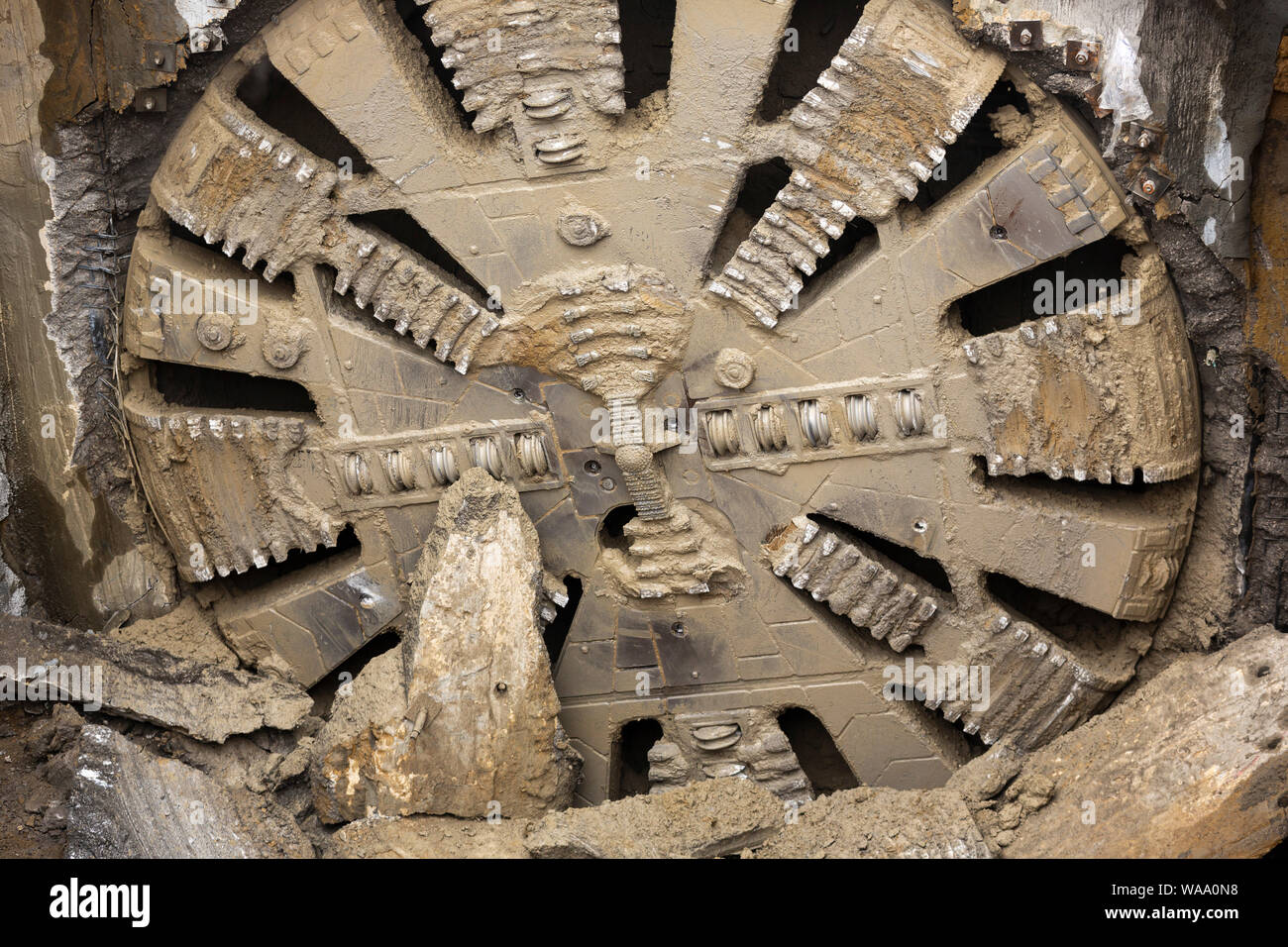 Tunnel Boring Machine front head element is seen on a subway station under construction. Stock Photo