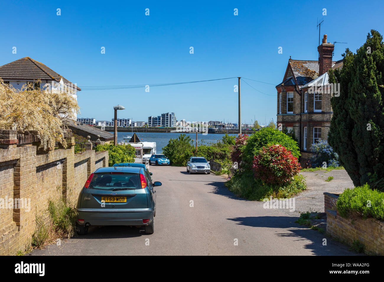 A view down Admiralty Road Upnor in Kent to housing on the opposite
