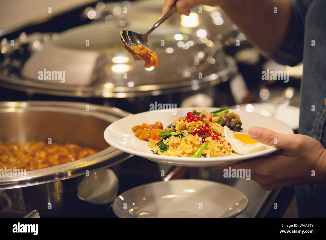 Woman eat the breakfast set in a hotel - people with breakfast in hotel concept Stock Photo