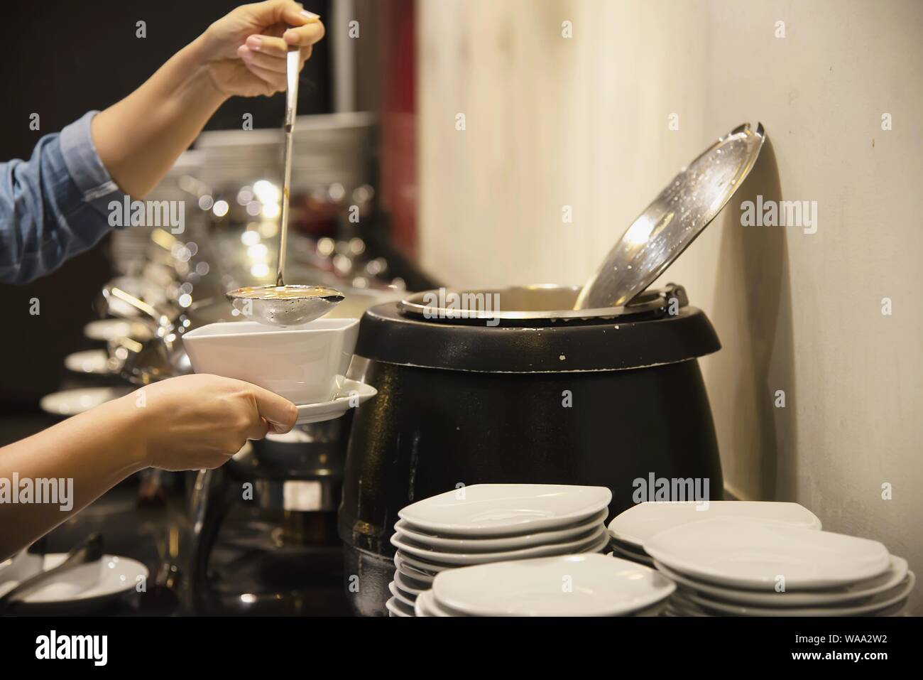 Woman eat the breakfast set in a hotel - people with breakfast in hotel concept Stock Photo