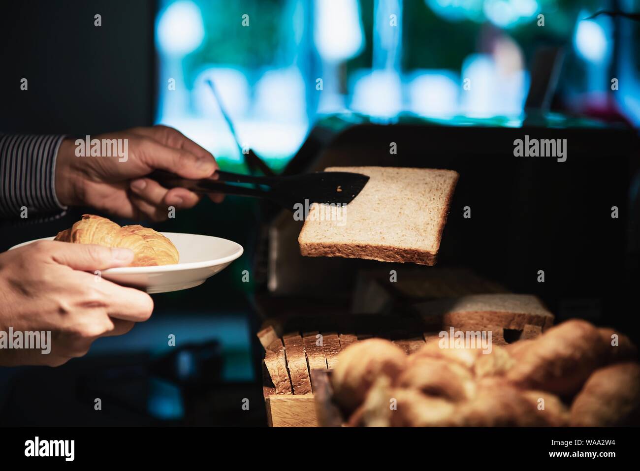 Business man eat the American breakfast set in a hotel - people take a breakfast in hotel concept Stock Photo