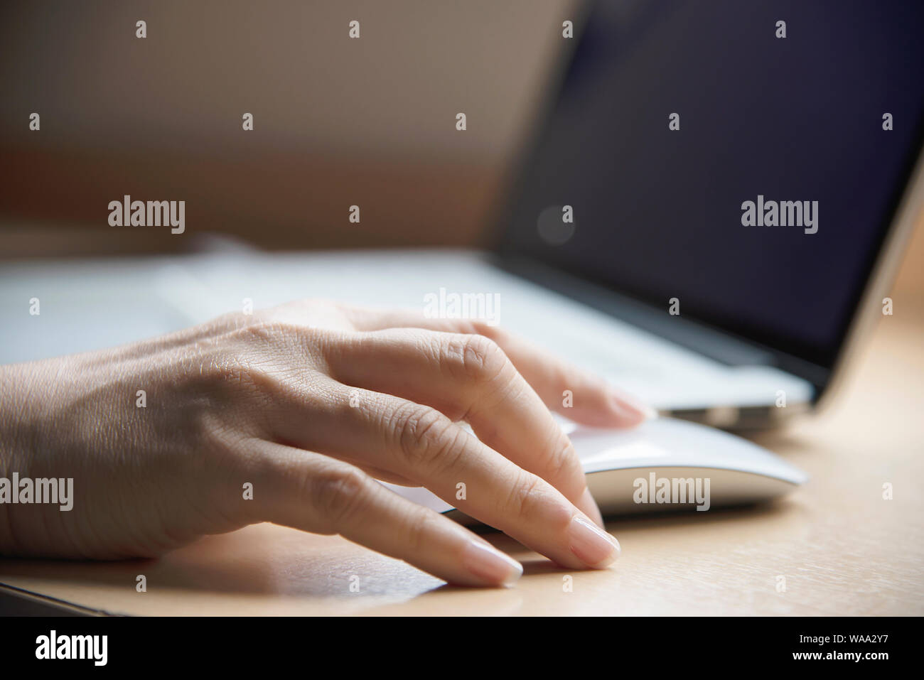 Lady finger touch or press laptop mouse  - people working with technology concept Stock Photo