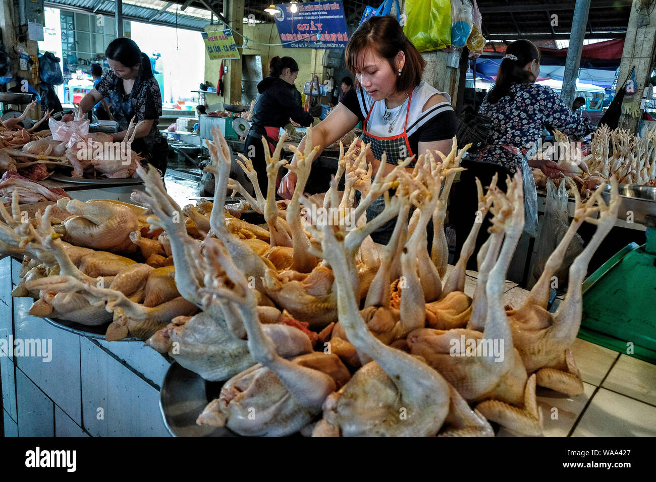Sa Pa, Vietnam - August 24: Hmong woman selling meat at the market on August 24, 2018 in Sa Pa, Vietnam. Stock Photo
