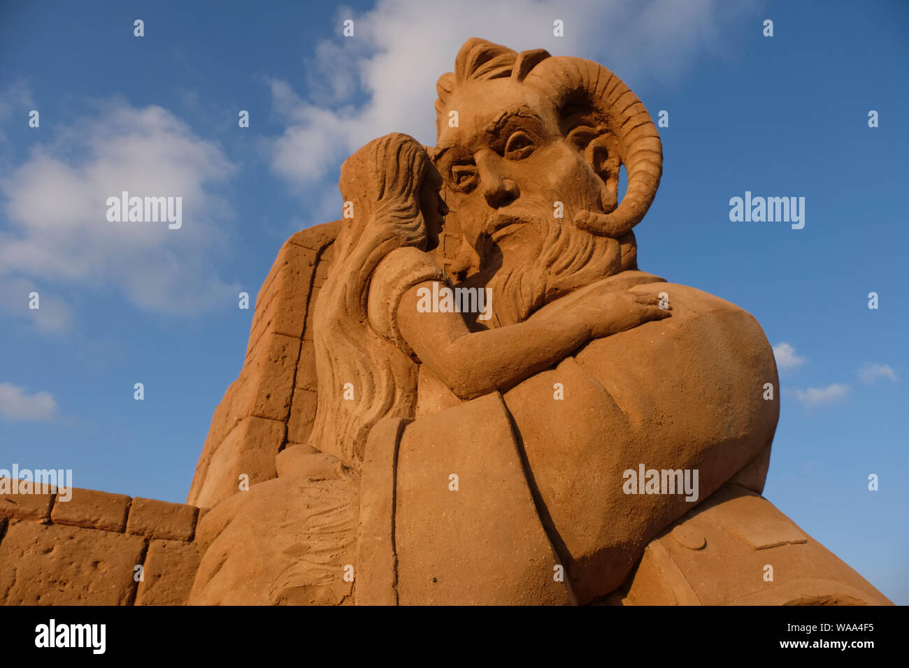 A sand sculpture based on the 'Beauty and the Beast' fairy tale made by Spanish sand sculptors Montserrat Cuesta Marin and Sergio Ramírez Perez on show at the first International Sand Sculpture Festival starring leading artists and all time favorite mythical heroes taking place in Bar Kochba beach in the southern city of Ashkelon in Israel Stock Photo