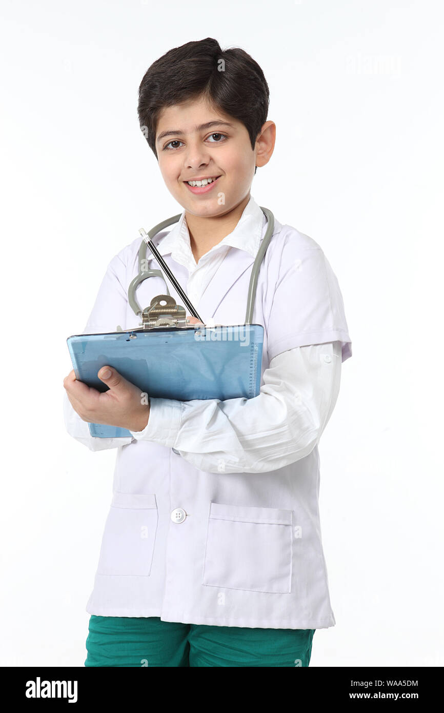  boys medicals Boy dressed up as a doctor and examining a medical report Stock Photo -  Alamy