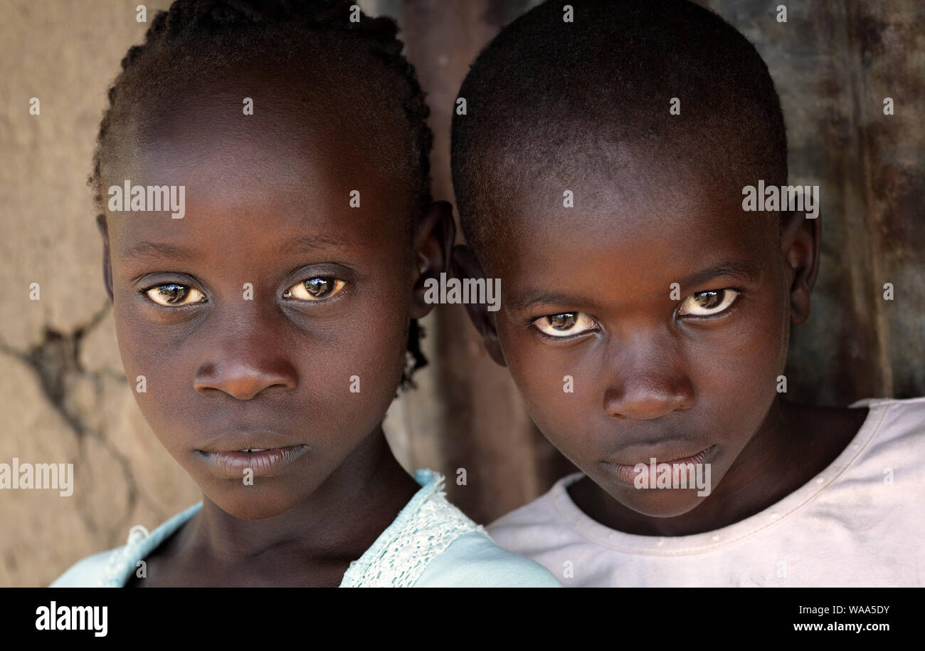 Portrait of a boy and girl in a slum in Nairobi, Kenya Stock Photo