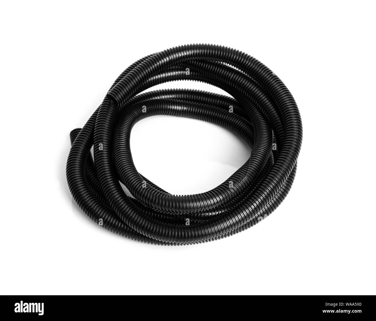 Corrugated plastic hose for electrical wiring on a white background. Stock Photo