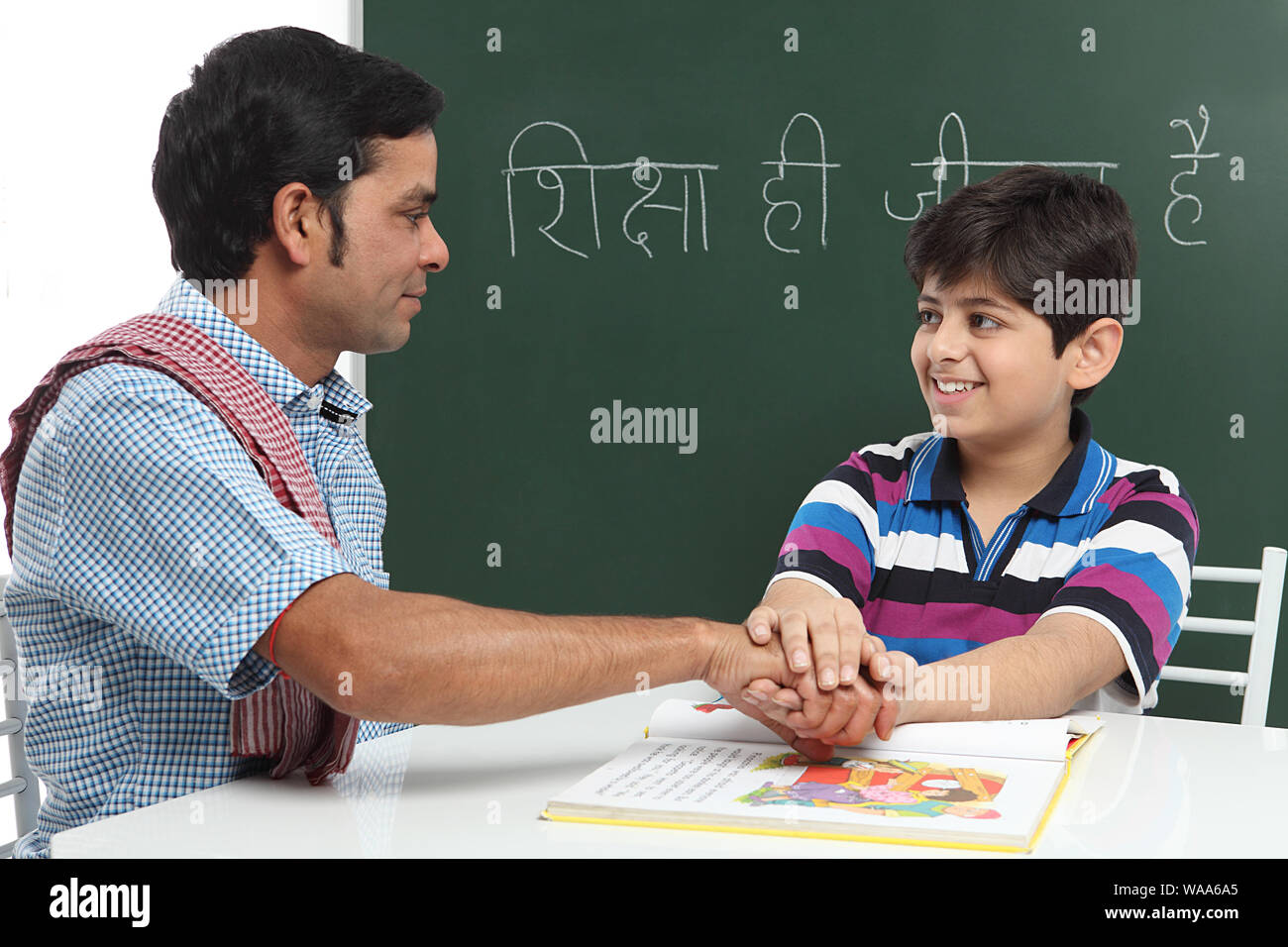 Boy teaching his servant Stock Photo Alamy