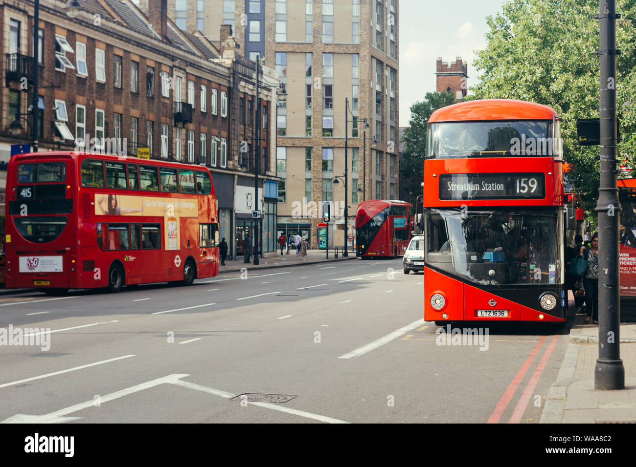 London / UK - July 16, 2019: Passengers getting on a red doubledecker bus towards Streatham Station on the Brixton Road in Lambeth Stock Photo
