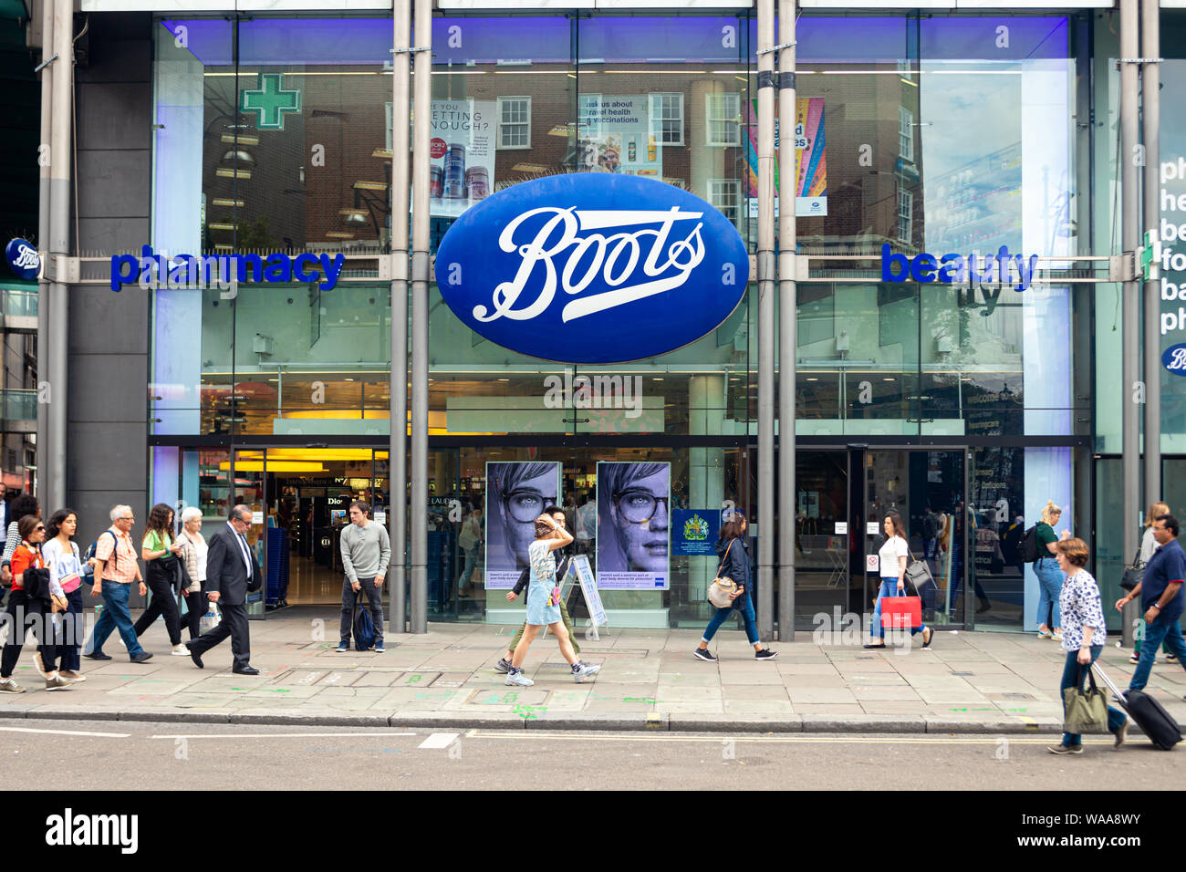London, UK - July 18, 2019: People walking in front of the Boots pharmacy  on Oxford Street, London. Oxford Street is one of the most famous shopping  s Stock Photo - Alamy