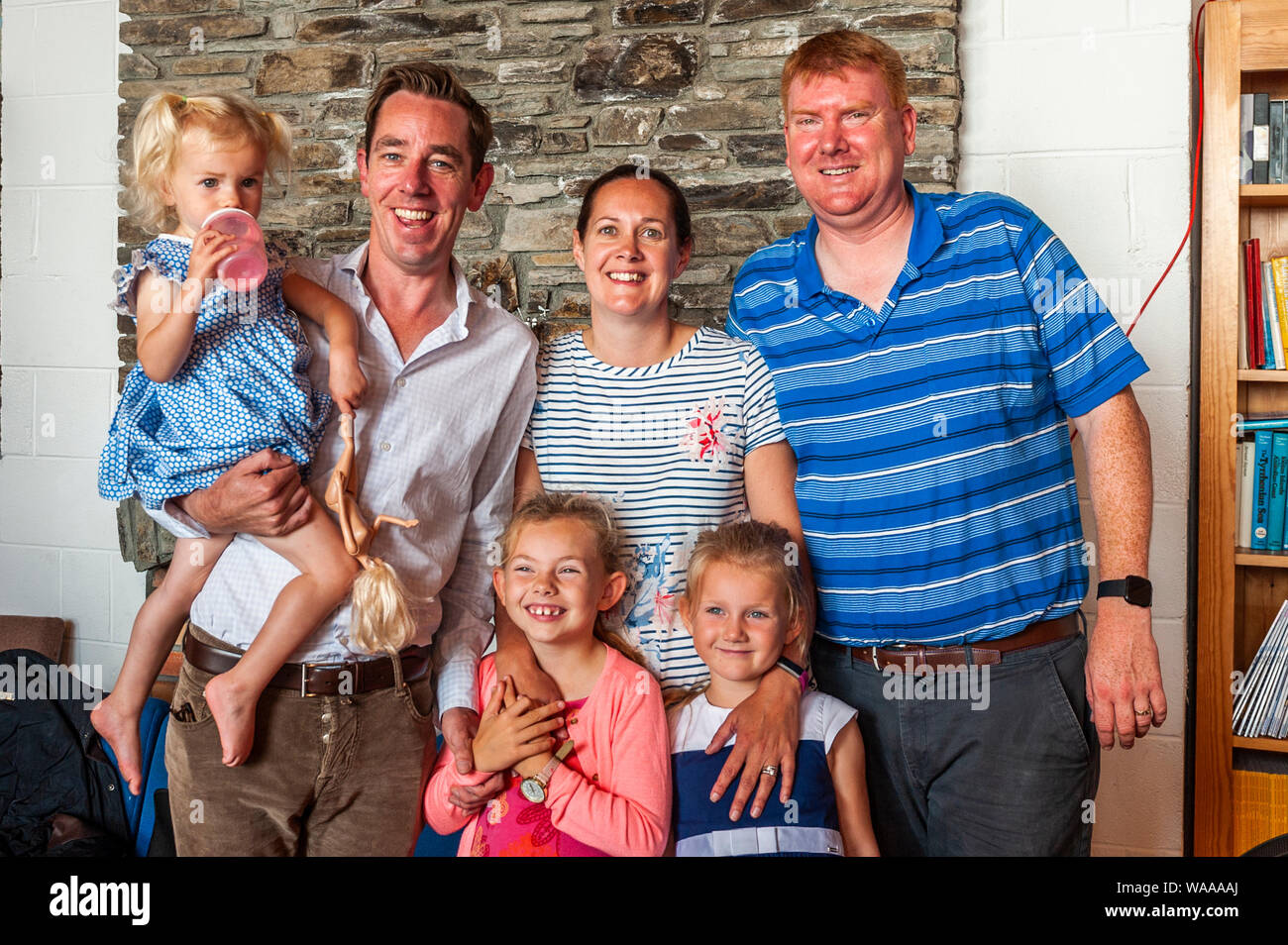 Schull, West Cork, Ireland. 19th Aug, 2019. After many years of invitations, TV and radio star Ryan Tubridy finally came to Schull to present his show on RTE Radio 1 today.  He interviewed local people and posed for pictures afterwards, before going on a walkabout in Schull Village. With Ryan Tubridy were Cape Clear Ferry owners Brendan, Karen, Caoimhe, Ciara and Róisín Cottrell. Credit: AG News/Alamy Live News. Stock Photo