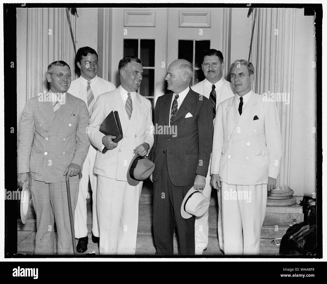 Civil Aeronautics Authority makes first official visit to the White House. Washington, D.C., Sept. 1. The newly created Civil Aeronautics Authority paid it's first visit to the White House today in it's official capacity to report to the president about the progress of the commission. Left to right; front; Harlee Branch, Edward J. Noble, Chairman, Robert Hinckley, and Oswald Ryan. Left to r, rear; G. Grant Mason, and Clinton Hester, 9/1/38 Stock Photo