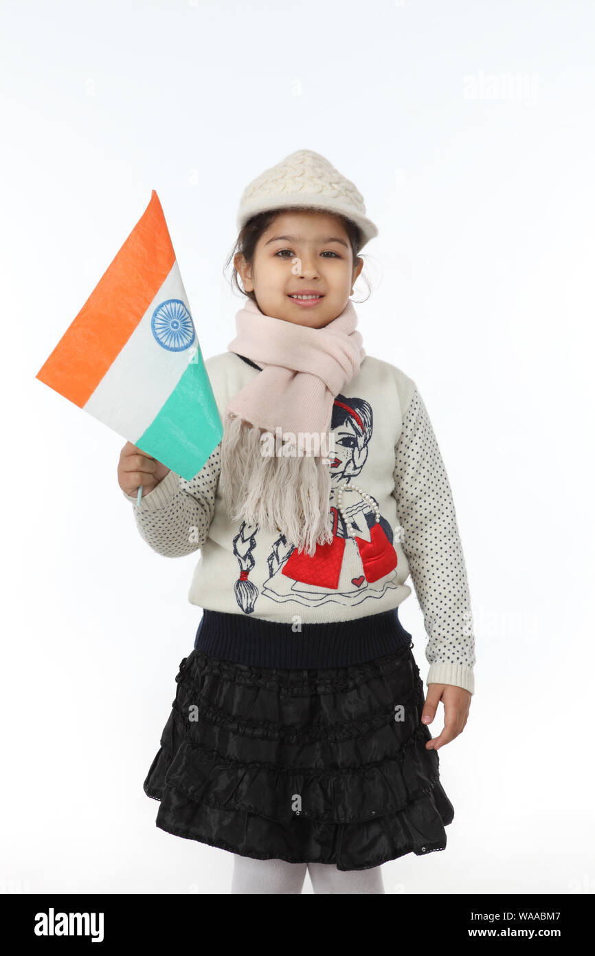 Indian girl holding an indian flag hires stock photography and images