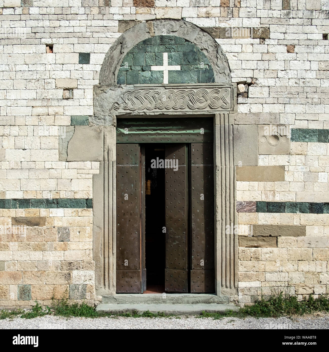 Detail of the facade of Romanesque  Church of Sant'Agata. Sant'Agata, Florence province, Italy. Stock Photo