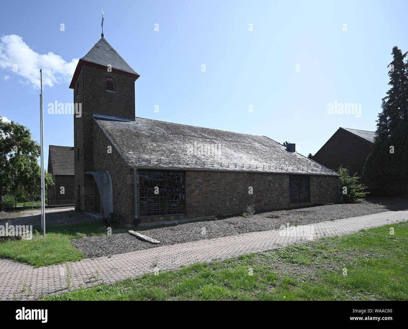Merzenich, Germany. 19th Aug, 2019. The church St. Lambertus in Morschenich-Alt is to be used culturally with the income from the first 'Hambi-Honey'. The project #OriginalHambiHoney is a cooperation between the municipality of Merzenich and a civil society initiative that is committed to sustainable structural change in the Rhineland region. Credit: Henning Kaiser/dpa/Alamy Live News Stock Photo