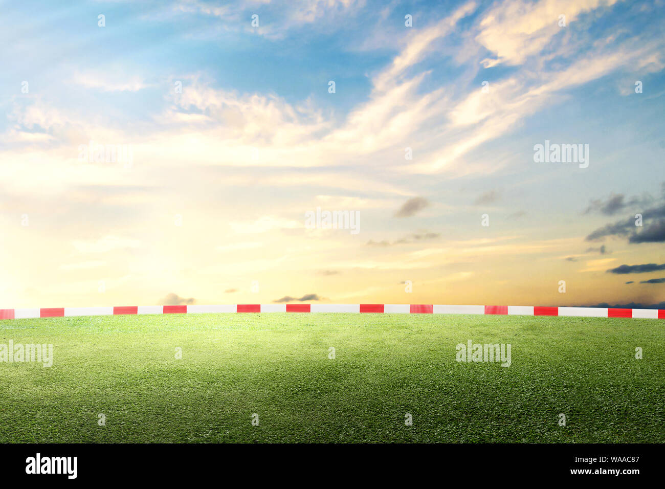 Green field with the blue sky background Stock Photo - Alamy