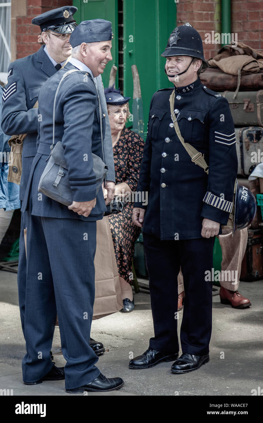 HORSTED KEYNES, SUSSEX/UK - MAY 7 :  Men in uniform at Horsted Keynes Railway Station in Horsted Keynes Sussex on May 7, 2011. Four unidentified people Stock Photo