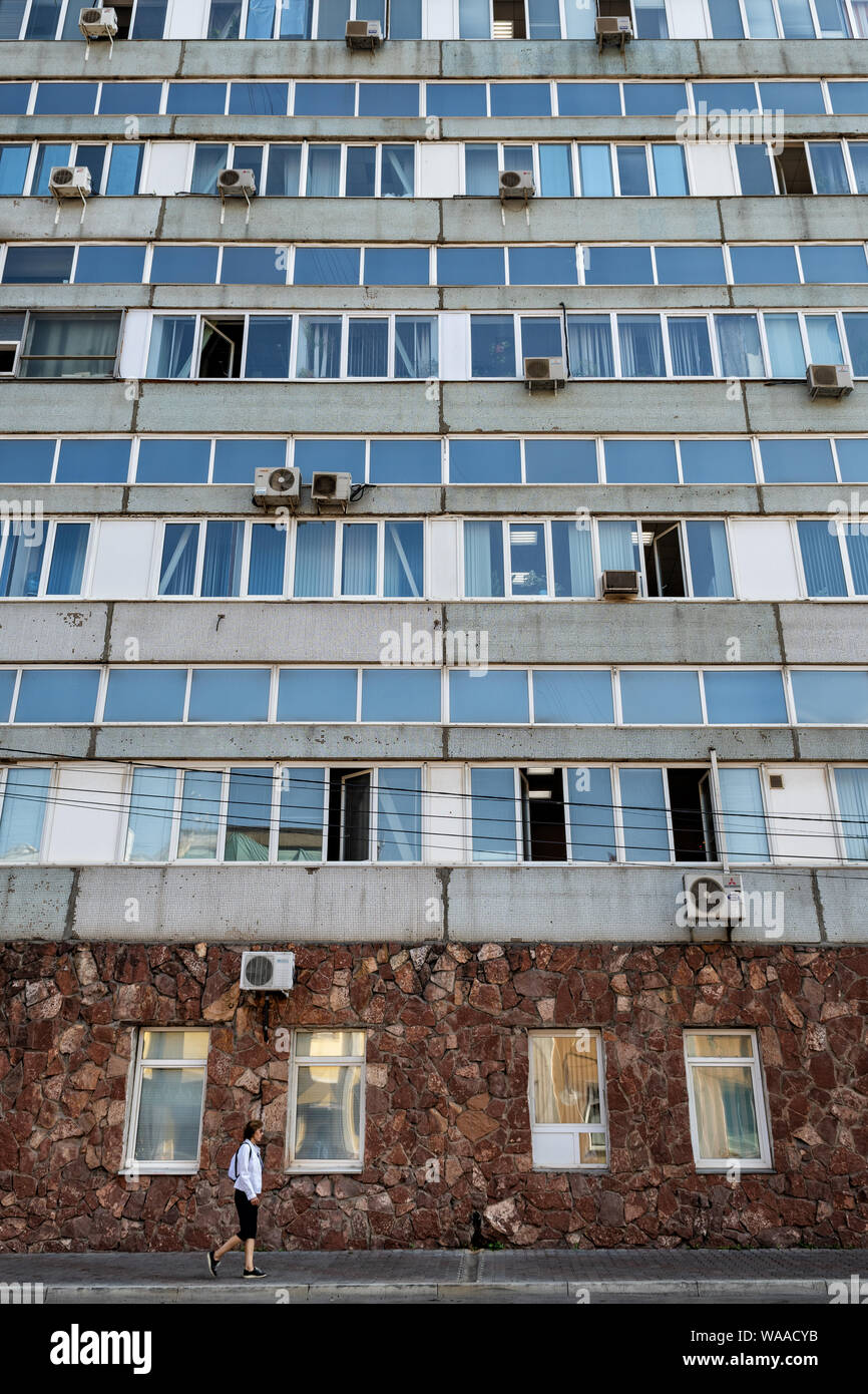 Facade of a Krasnoyarsk building with many air conditioners, Siberia, Russia Stock Photo