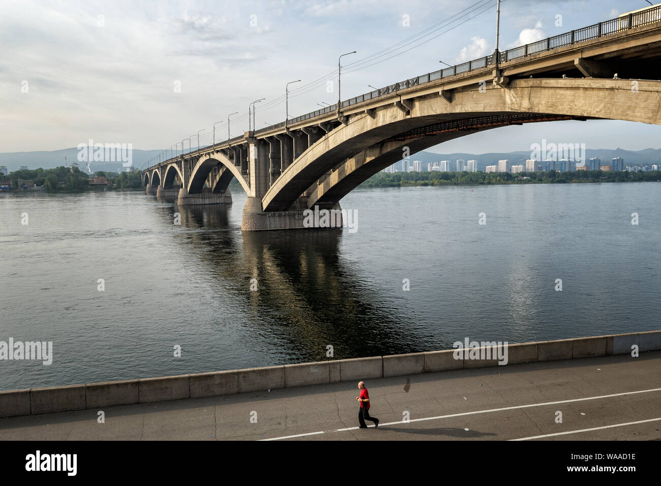 Communal bridge over the Yenisei river in Krasnoyarsk, Siberia, Russia Stock Photo
