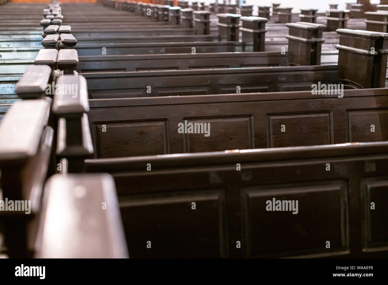 Cathedral pews. Rows of benches in christian church. Heavy solid