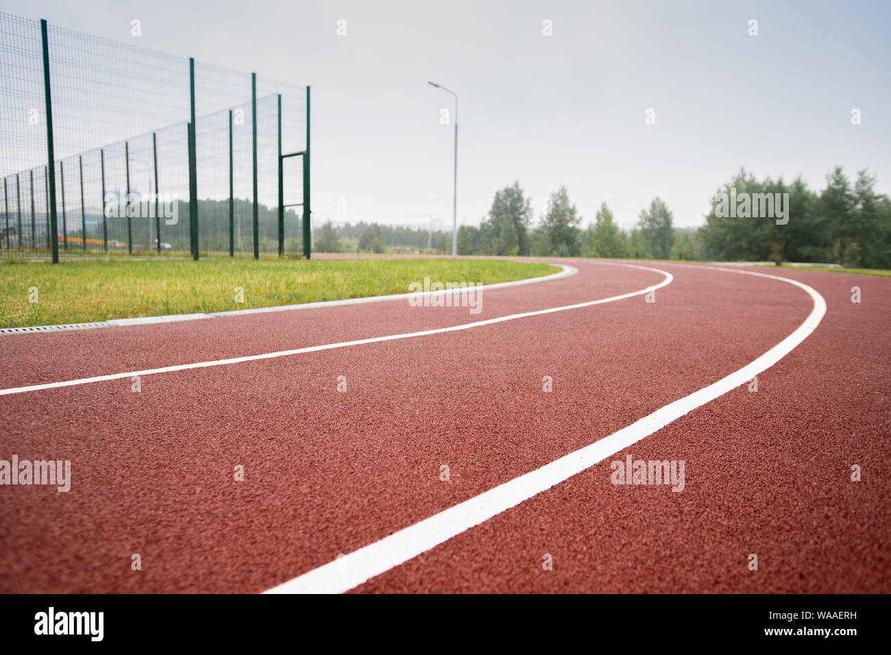 White dividing line making up race tracks in diminishing perspective Stock Photo