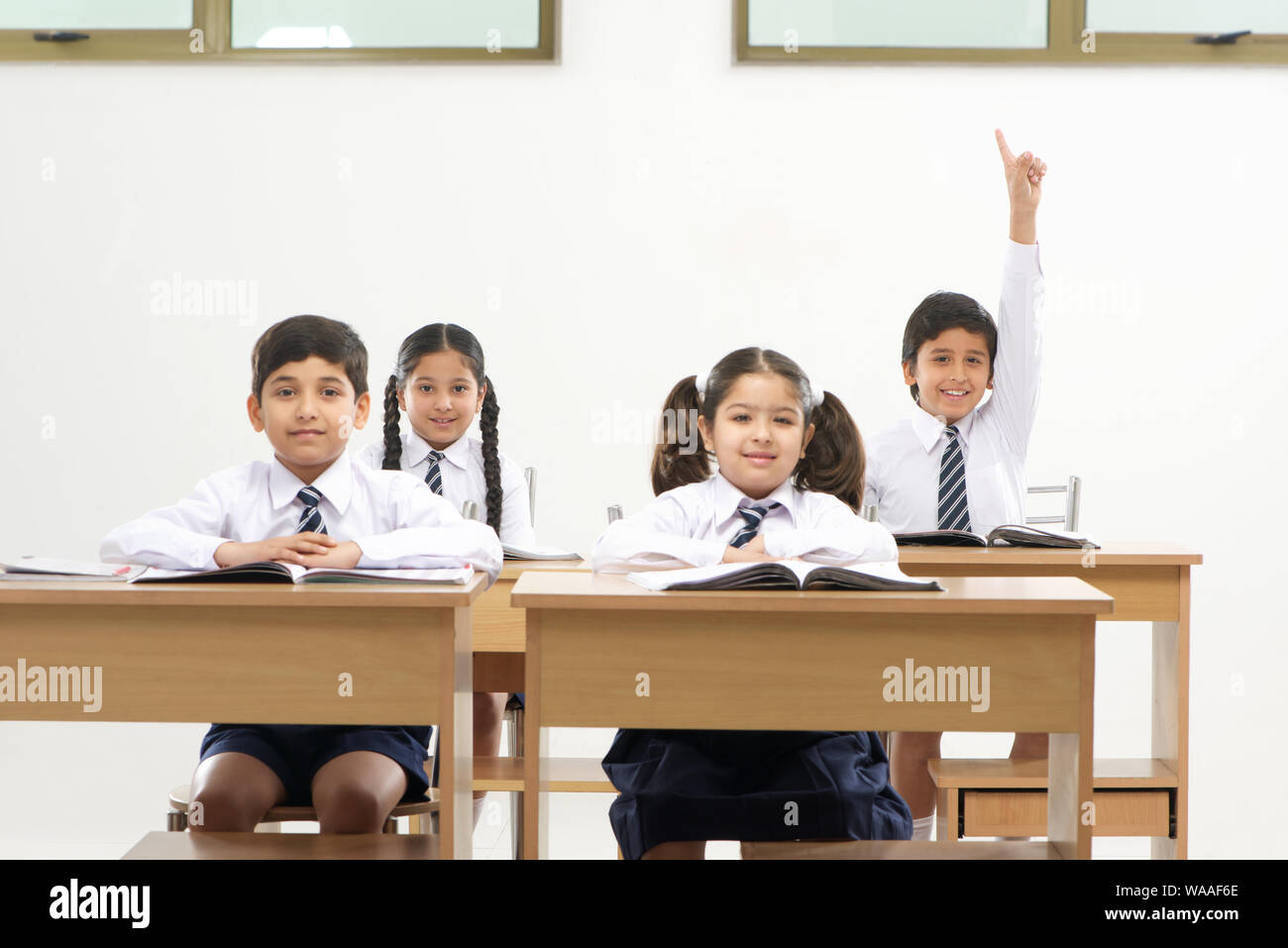 School children studying in a classroom Stock Photo - Alamy