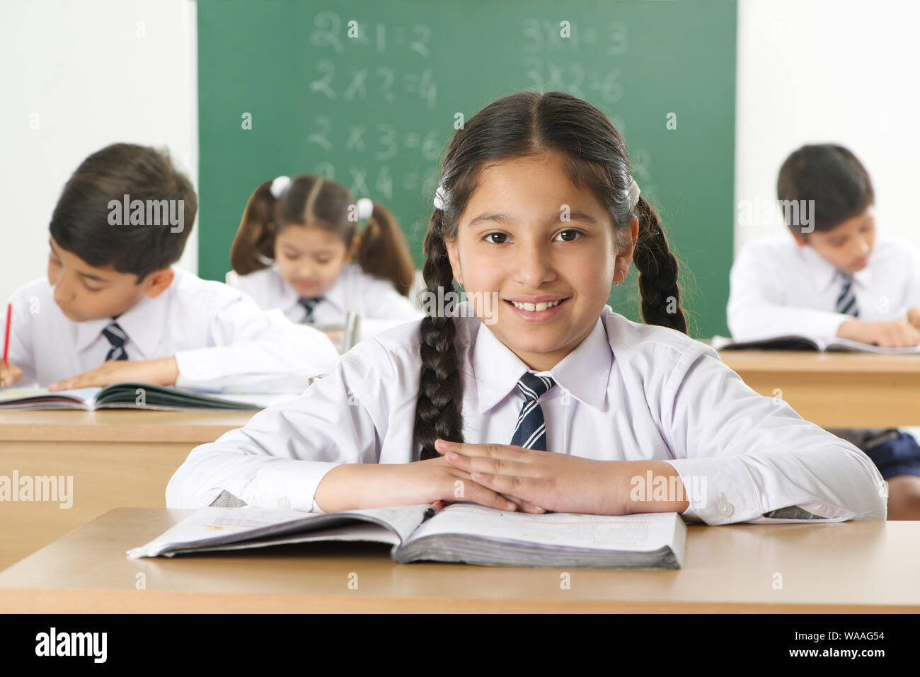 School children studying in a classroom Stock Photo - Alamy