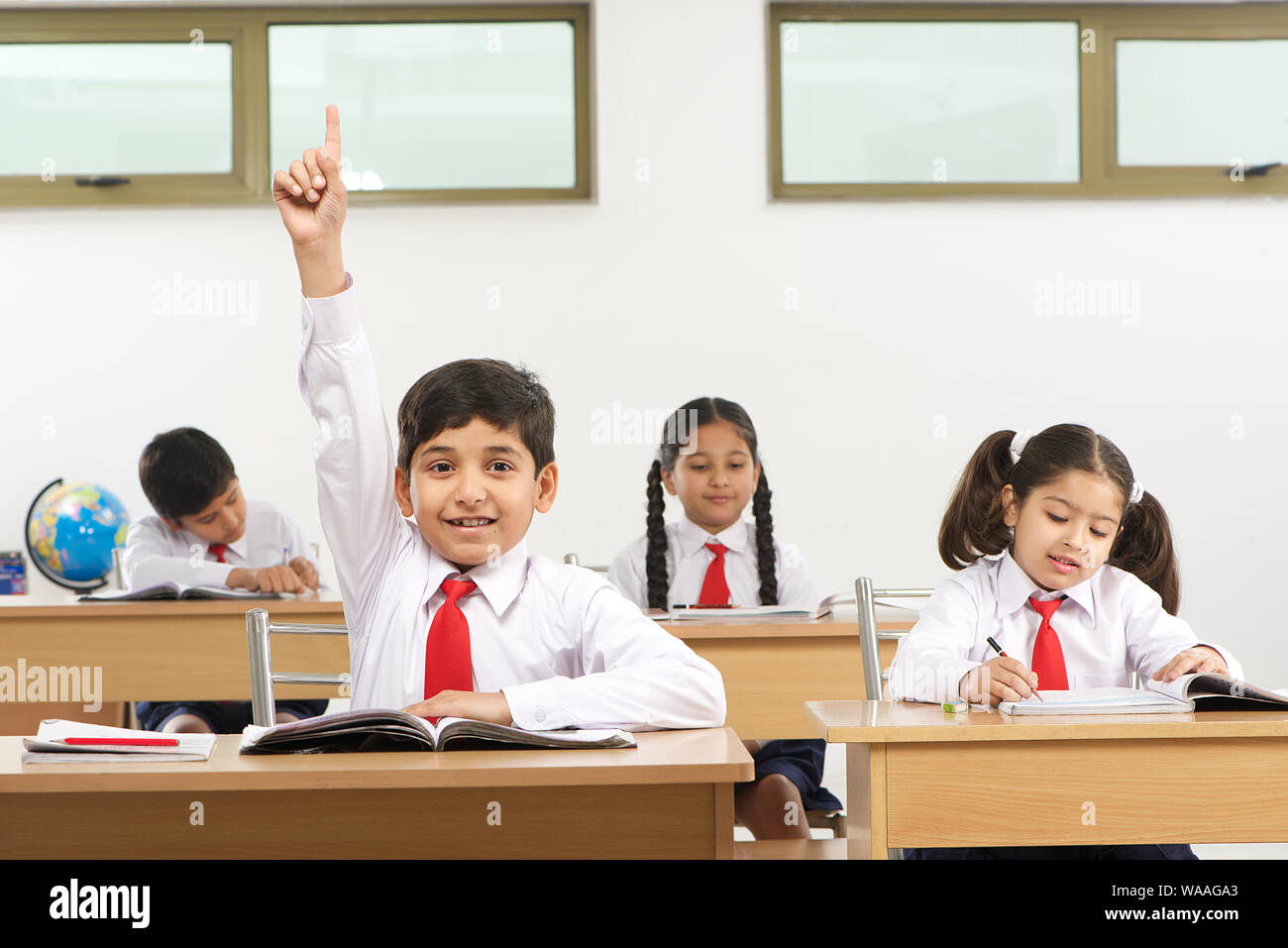 School children studying in a classroom Stock Photo - Alamy