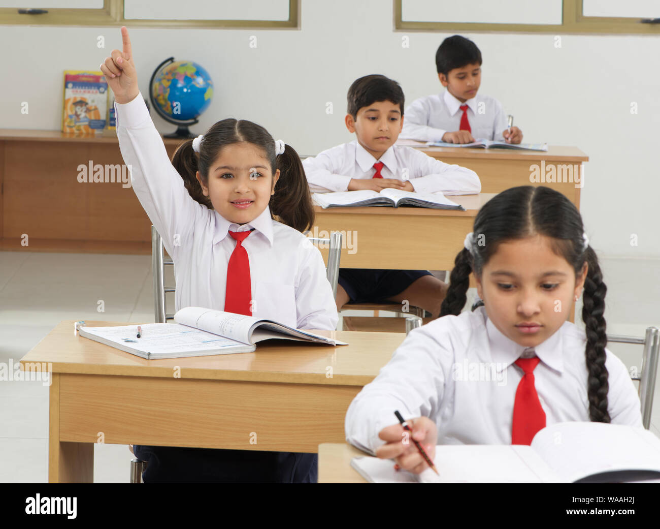 School children studying in a classroom Stock Photo - Alamy