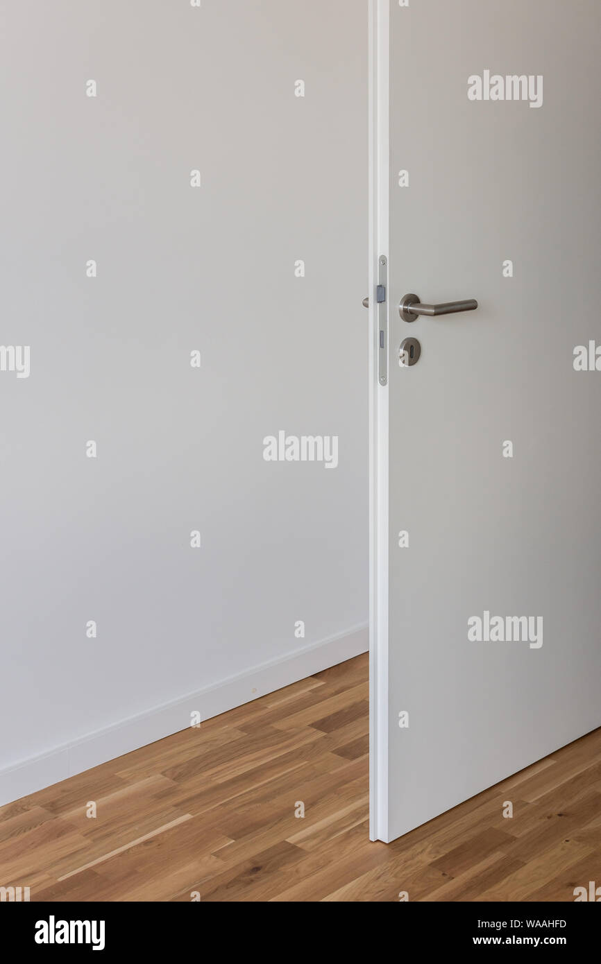 Open White Door With A Gray Chrome Handle And Keyhole Against A White Wall In The Room Stock Photo Alamy