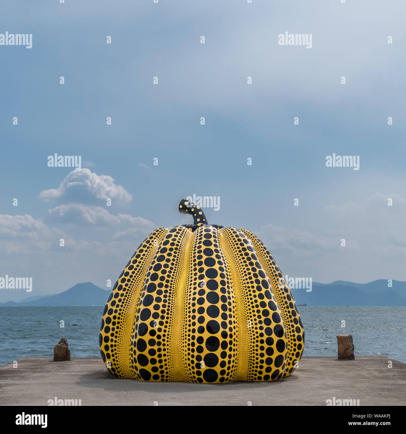 A square image of the yellow pumpkin by Yayoi Kusama on Naoshima, Japan Stock Photo