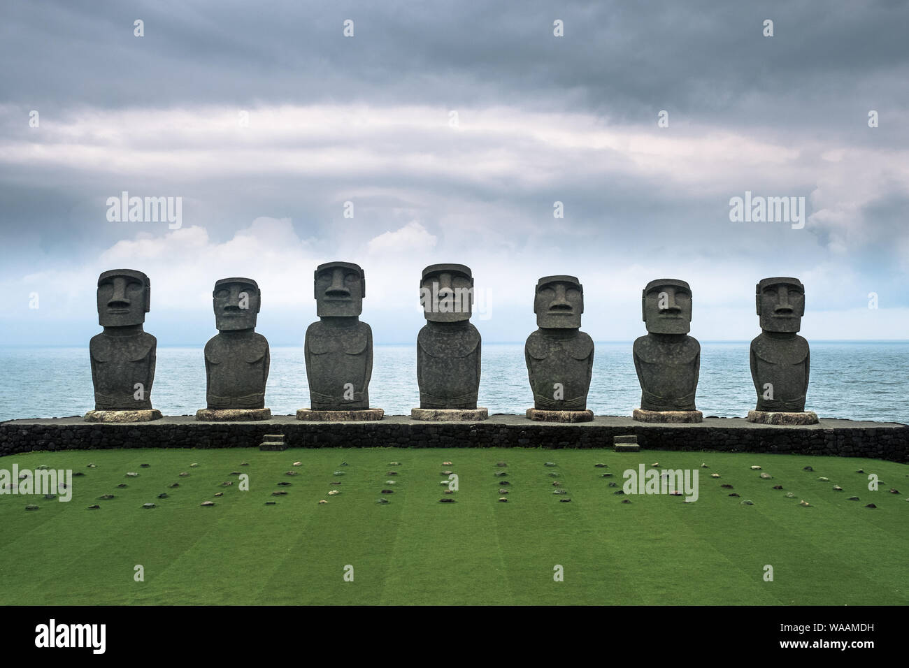 The seven Easter Island replica Moai statues at Sun Messe Nichinan in Miyazaki Prefecture with the Pacific Ocean in the background, Kyushu, Japan Stock Photo