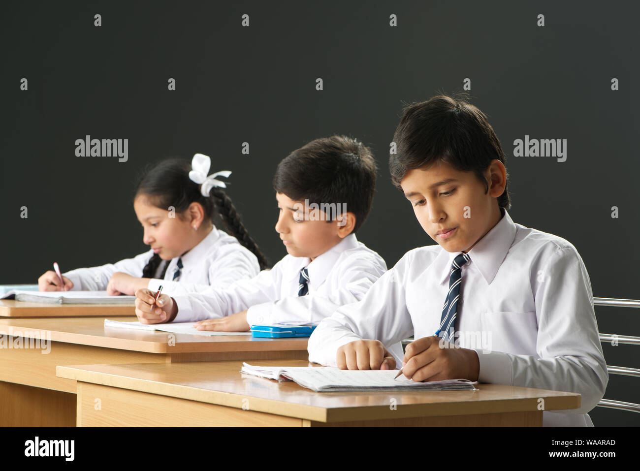 School children studying in a classroom Stock Photo - Alamy